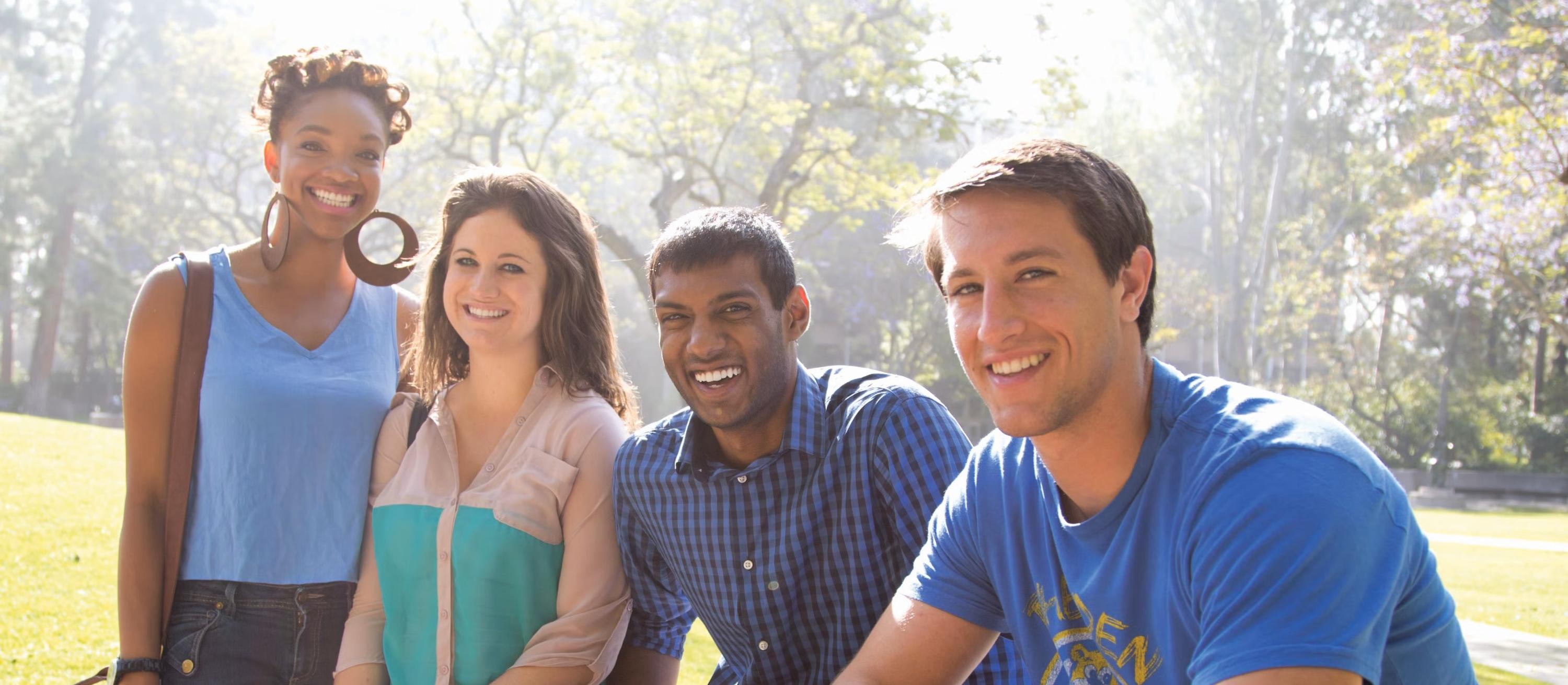Four students smiling